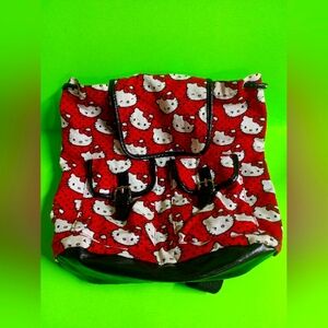 Hello Kitty Lounge Fly Mini Canvas Slouch Backpack. Draw String Closure, Snap On